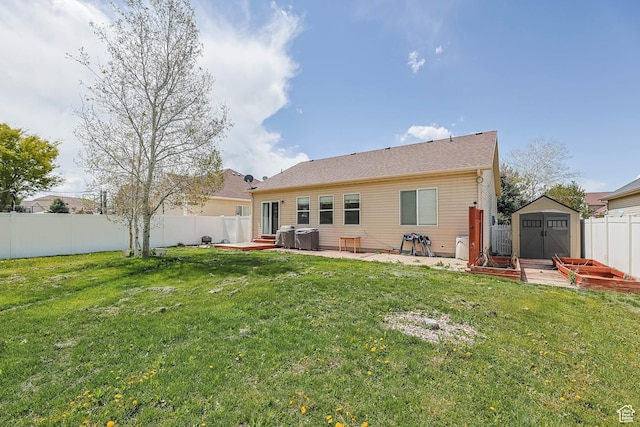 5454 N Windsor Way E, Stansbury Park, UT 84074 - rear view of property with a fenced backyard, a storage unit, and a patio area