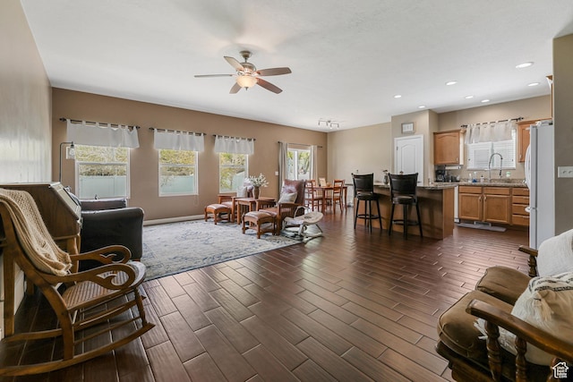 5454 N Windsor Way E, Stansbury Park, UT 84074 - living area with a ceiling fan, wood finish floors, and recessed lighting