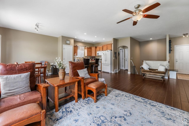 5454 N Windsor Way E, Stansbury Park, UT 84074 - living area with a ceiling fan, light wood-style flooring, recessed lighting, and arched walkways