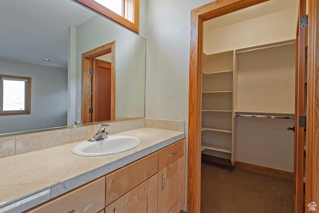 152 N Silver Oak Rd, Salt Lake City, UT 84108 - bathroom featuring a walk in closet and vanity