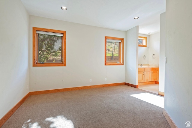 152 N Silver Oak Rd, Salt Lake City, UT 84108 - unfurnished room with baseboards, recessed lighting, light carpet, and a sink