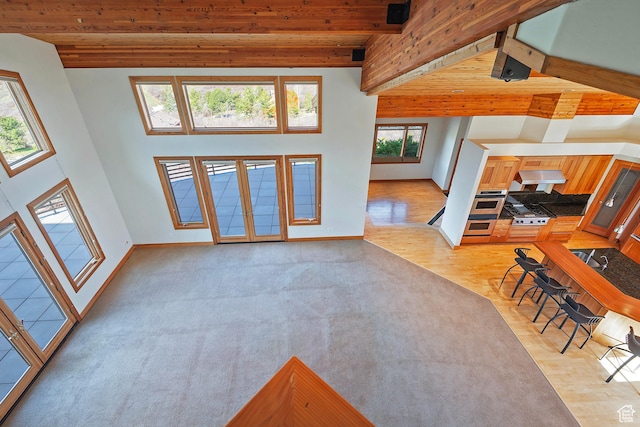 152 N Silver Oak Rd, Salt Lake City, UT 84108 - living room with light wood-style floors, french doors, beamed ceiling, and baseboards