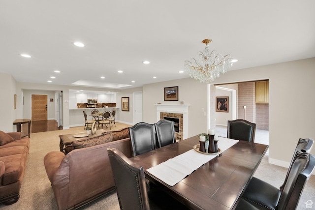 171 E 3rd Ave Unit 301, Salt Lake City, UT 84103 - dining area featuring a chandelier, baseboards, a tile fireplace, recessed lighting, and light carpet