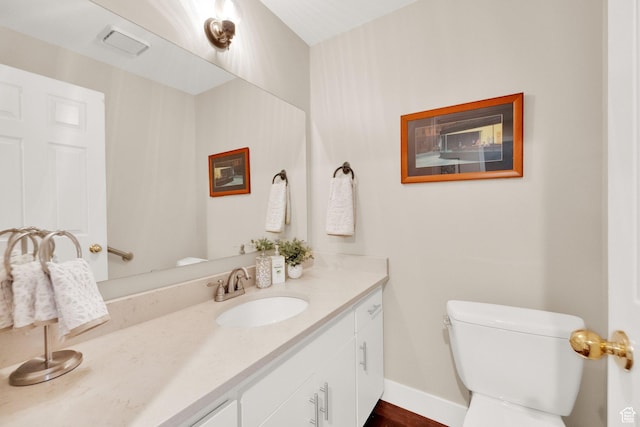 171 E 3rd Ave Unit 301, Salt Lake City, UT 84103 - bathroom with baseboards, toilet, and vanity