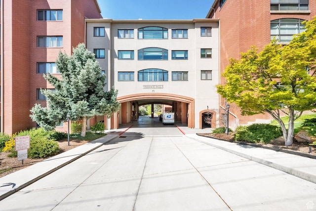 171 E 3rd Ave Unit 301, Salt Lake City, UT 84103 - view of property featuring a carport and concrete driveway