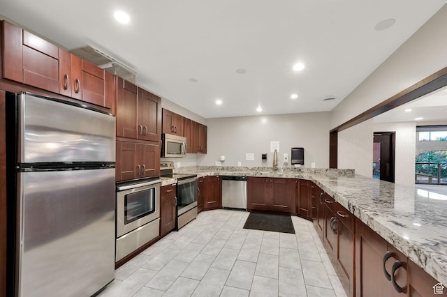 171 E 3rd Ave Unit 301, Salt Lake City, UT 84103 - kitchen featuring recessed lighting, stainless steel appliances, and light stone counters