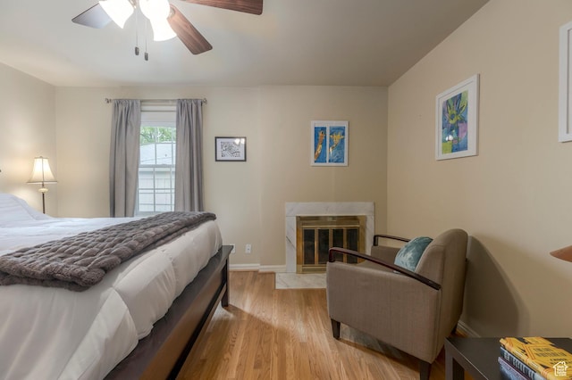 1280 E 3rd Ave N, Salt Lake City, UT 84103 - bedroom with ceiling fan, light wood-style flooring, a high end fireplace, and baseboards