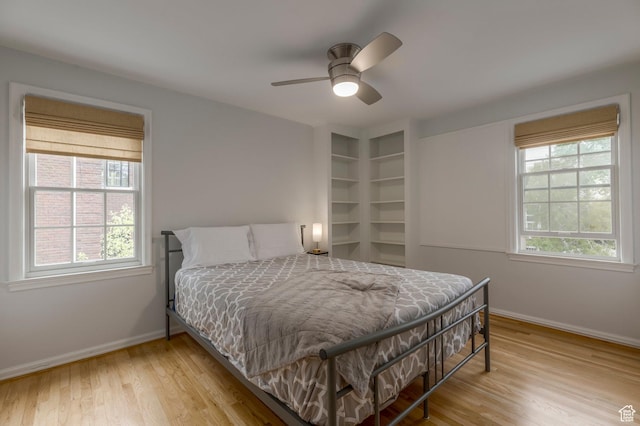 1280 E 3rd Ave N, Salt Lake City, UT 84103 - bedroom featuring baseboards, wood finished floors, and multiple windows