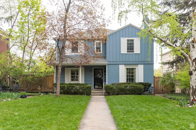 1280 E 3rd Ave N, Salt Lake City, UT 84103 - traditional-style house with a front lawn, a gate, board and batten siding, and fence
