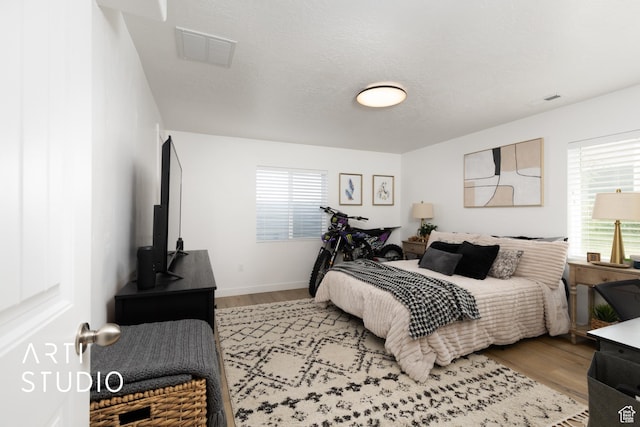 661 W 1820 S, Provo, UT 84601 - bedroom with visible vents, wood finished floors, and multiple windows