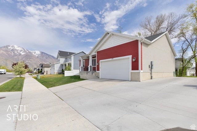 661 W 1820 S, Provo, UT 84601 - view of side of property with a mountain view, driveway, a yard, and an attached garage