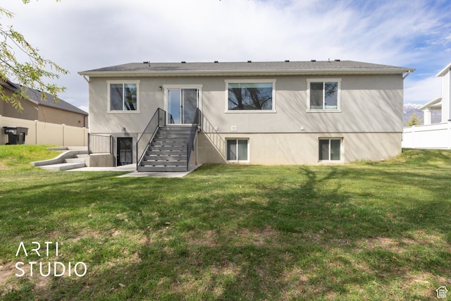 661 W 1820 S, Provo, UT 84601 - rear view of house featuring fence, a yard, stairs, and stucco siding