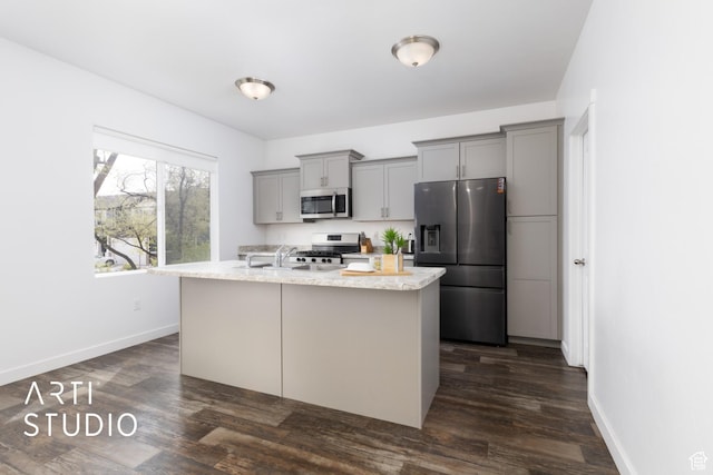 661 W 1820 S, Provo, UT 84601 - kitchen with stainless steel appliances, an island with sink, dark wood finished floors, and gray cabinets