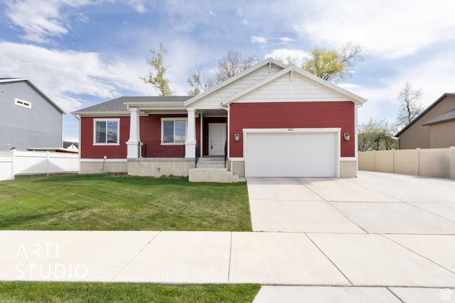 view of front of home with covered porch, fence, driveway, a front lawn, and an attached garage