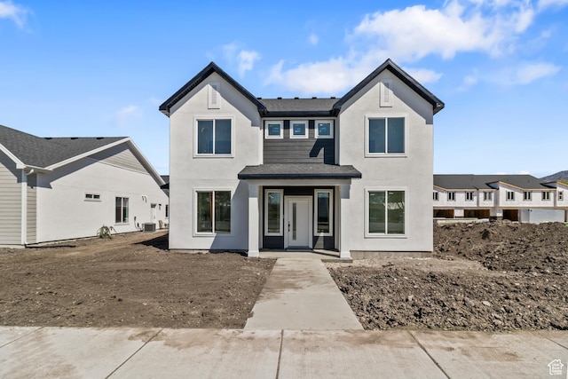 modern farmhouse style home with stucco siding
