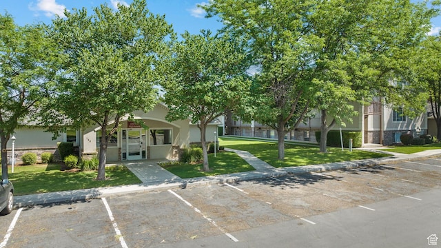 1514 S 200 E, Orem, UT 84058 - view of front of property with uncovered parking, a front lawn, stucco siding, and stone siding