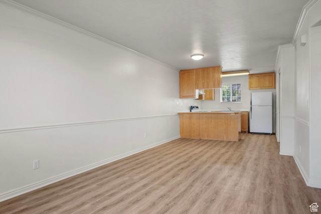 1514 S 200 E, Orem, UT 84058 - kitchen with freestanding refrigerator, light wood-type flooring, ornamental molding, a peninsula, and light countertops