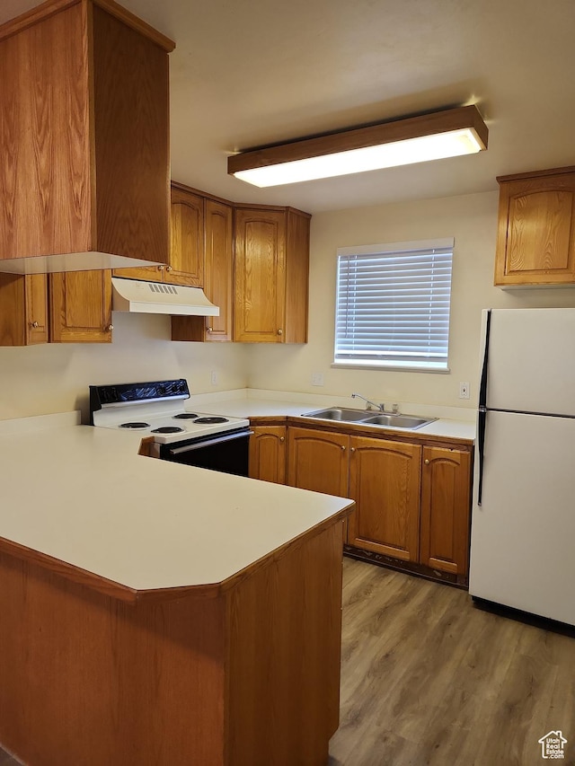 1514 S 200 E, Orem, UT 84058 - kitchen featuring electric stove, freestanding refrigerator, brown cabinetry, under cabinet range hood, and a sink