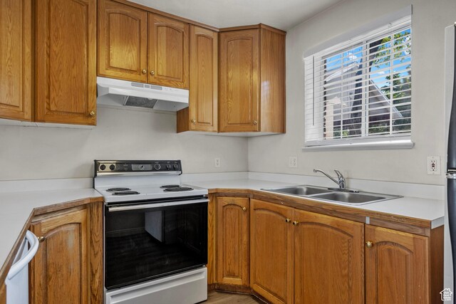 1514 S 200 E, Orem, UT 84058 - kitchen featuring white appliances, under cabinet range hood, light countertops, and brown cabinets