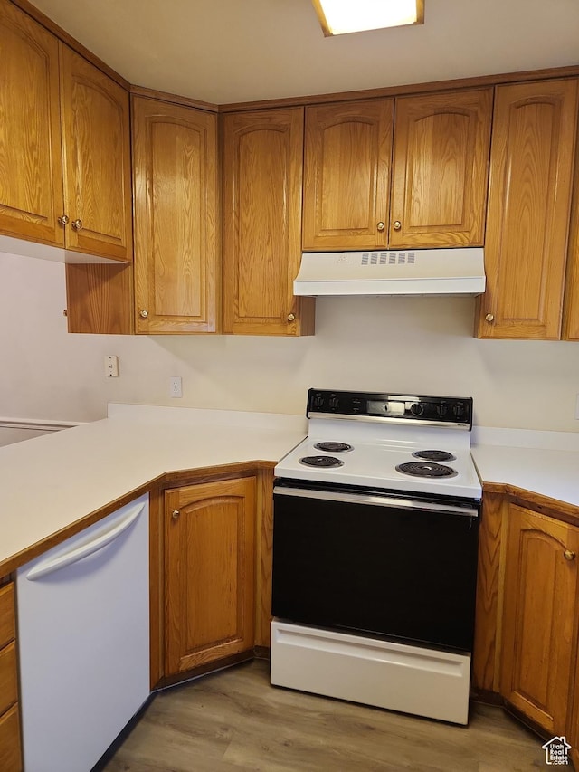 1514 S 200 E, Orem, UT 84058 - kitchen with light countertops, under cabinet range hood, light wood finished floors, white appliances, and brown cabinetry
