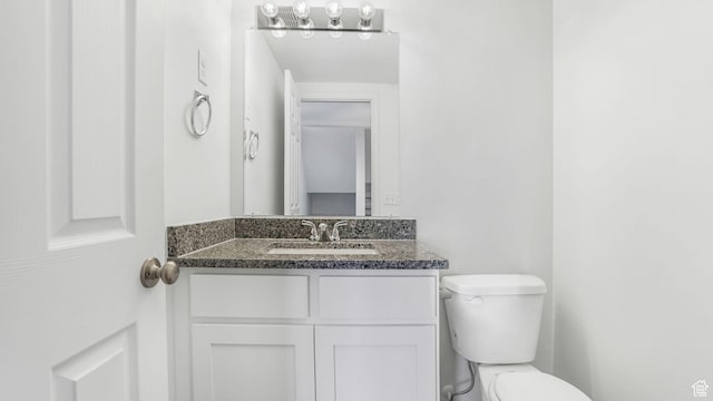 half bath with toilet and vanity
