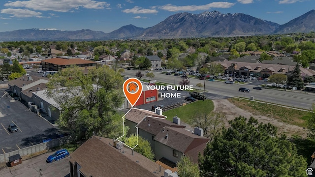 drone / aerial view featuring a residential view and a mountain view