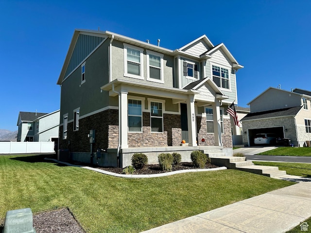 980 W 1275 S, Springville, UT 84663 - craftsman inspired home featuring a front lawn, stone siding, covered porch, and fence