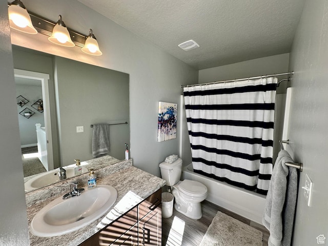 980 W 1275 S, Springville, UT 84663 - bathroom featuring shower / bathtub combination with curtain, vanity, toilet, a textured ceiling, and wood finished floors