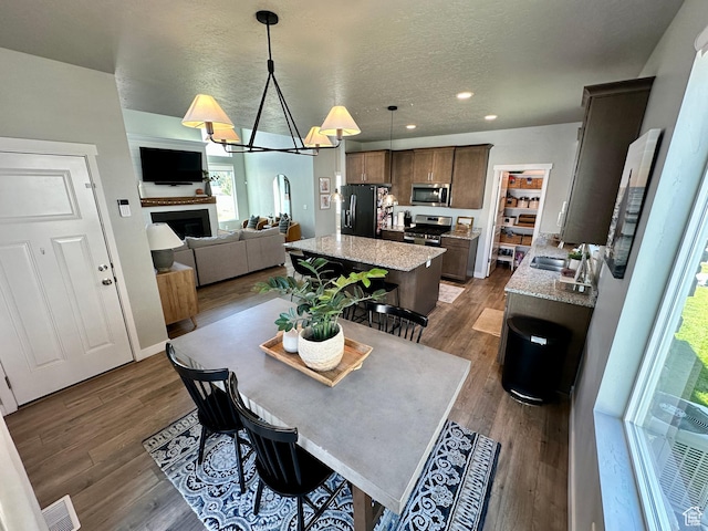 980 W 1275 S, Springville, UT 84663 - dining area featuring recessed lighting, visible vents, wood finished floors, and a fireplace