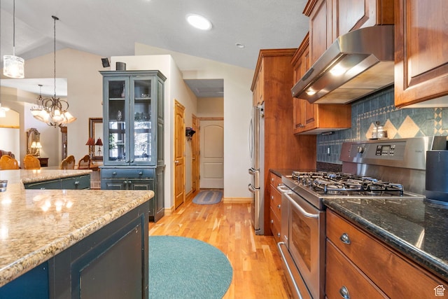 kitchen featuring decorative backsplash, stainless steel appliances, light wood-type flooring, ventilation hood, and brown cabinetry