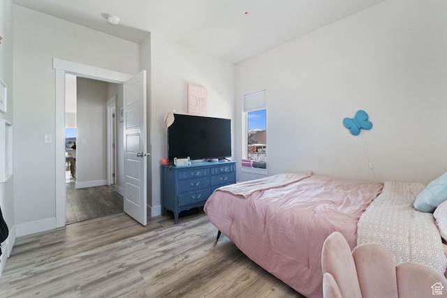 6463 W Maple Valley Cir S Unit 1030, West Jordan, UT 84081 - bedroom with baseboards and light wood-style flooring
