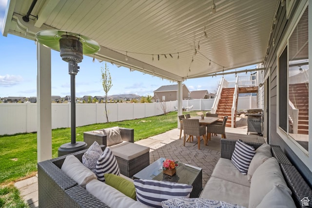 6463 W Maple Valley Cir S Unit 1030, West Jordan, UT 84081 - view of patio featuring stairway, a fenced backyard, an outdoor hangout area, and outdoor dining area