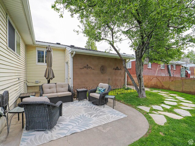 123 Lynnwood Dr, Clearfield, UT 84015 - view of patio featuring an outdoor living space and fence