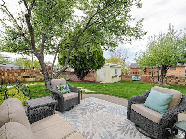 123 Lynnwood Dr, Clearfield, UT 84015 - view of patio / terrace featuring an outdoor hangout area, a fenced backyard, a shed, and an outdoor structure