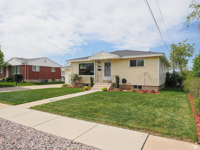 123 Lynnwood Dr, Clearfield, UT 84015 - bungalow-style house featuring a front lawn