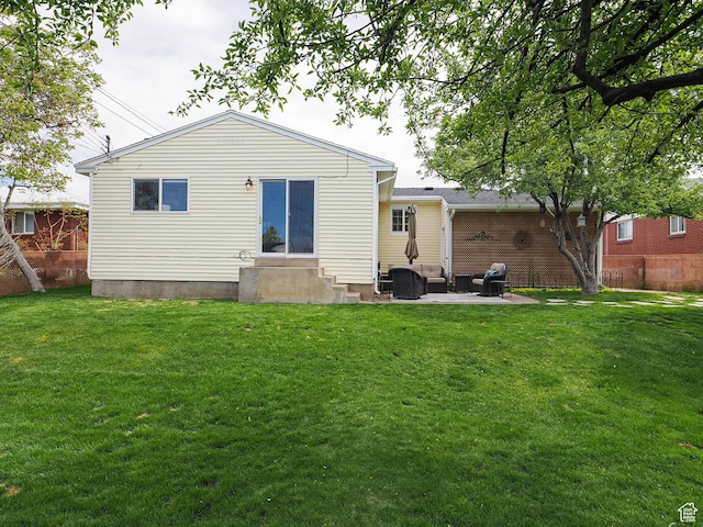 123 Lynnwood Dr, Clearfield, UT 84015 - back of house featuring a patio area, a yard, outdoor lounge area, entry steps, and fence