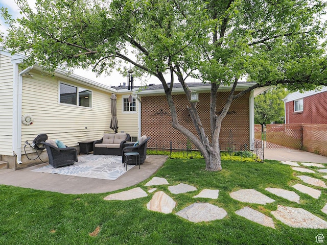 123 Lynnwood Dr, Clearfield, UT 84015 - back of house featuring a yard, an outdoor hangout area, a patio, and fence