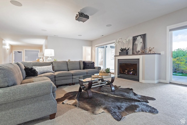 11274 S Eagle View Dr, Sandy, UT 84092 - living area featuring light colored carpet, a glass covered fireplace, and baseboards