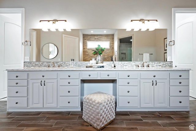 11274 S Eagle View Dr, Sandy, UT 84092 - bathroom with double vanity, wood finish floors, a stall shower, and a sink