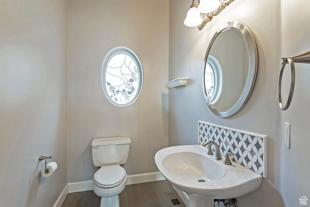 11274 S Eagle View Dr, Sandy, UT 84092 - bathroom featuring a sink, visible vents, baseboards, toilet, and wood finished floors
