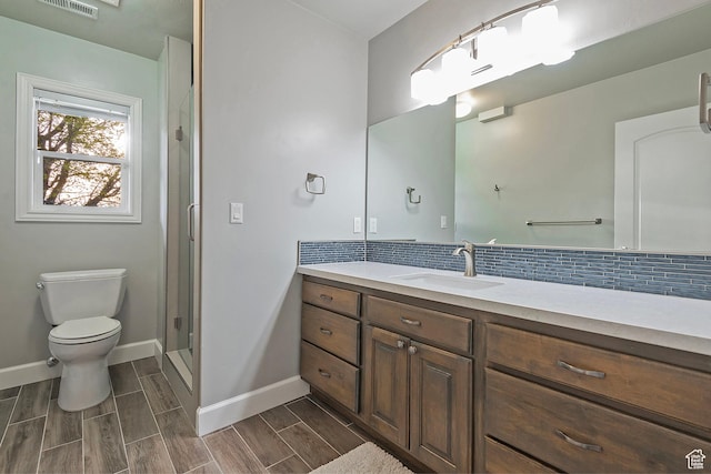 11274 S Eagle View Dr, Sandy, UT 84092 - full bath featuring vanity, tasteful backsplash, toilet, a stall shower, and baseboards