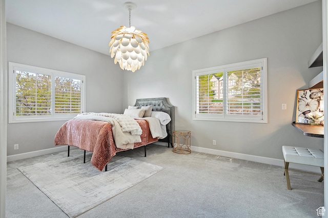 11274 S Eagle View Dr, Sandy, UT 84092 - bedroom with carpet floors, a notable chandelier, and multiple windows