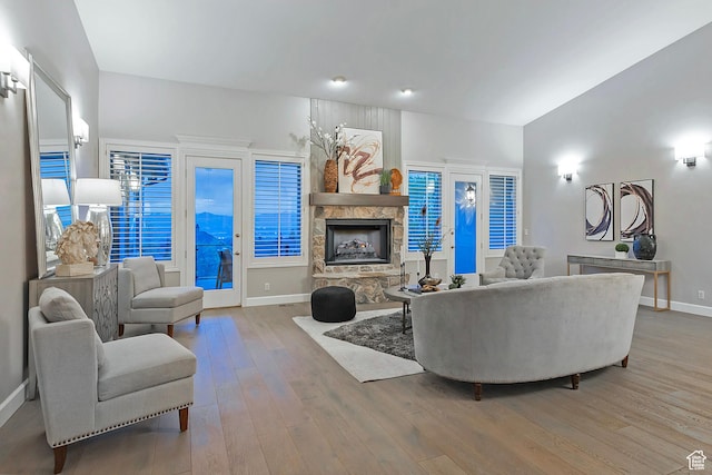 11274 S Eagle View Dr, Sandy, UT 84092 - living room featuring baseboards, wood finished floors, and a fireplace