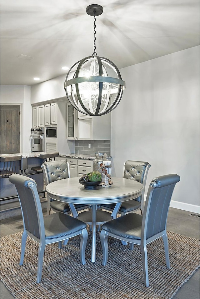 11274 S Eagle View Dr, Sandy, UT 84092 - dining room featuring recessed lighting, a chandelier, dark wood-style flooring, baseboards, and visible vents
