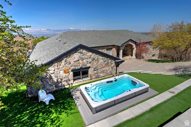 11274 S Eagle View Dr, Sandy, UT 84092 - view of pool with hot tub deck surround and a lawn