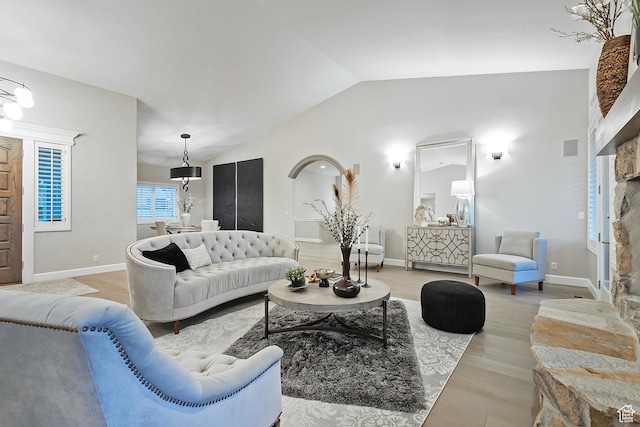 11274 S Eagle View Dr, Sandy, UT 84092 - living area with wood finished floors, vaulted ceiling, and baseboards
