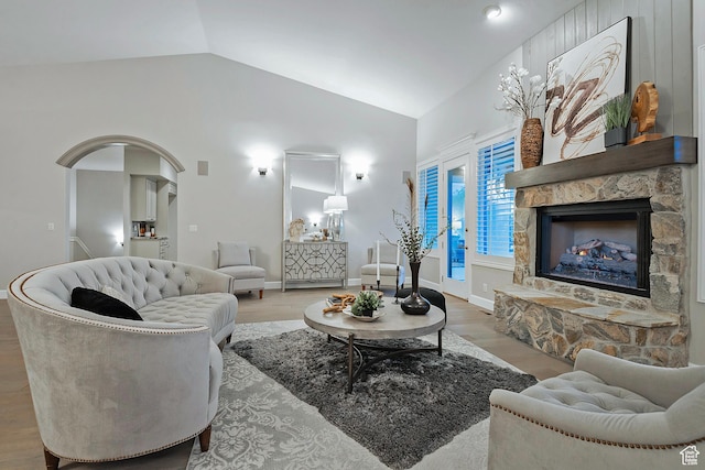 11274 S Eagle View Dr, Sandy, UT 84092 - living area featuring baseboards, wood finished floors, a fireplace, and lofted ceiling