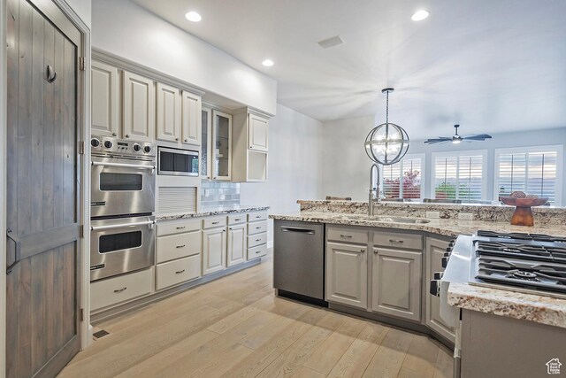 11274 S Eagle View Dr, Sandy, UT 84092 - kitchen featuring a sink, ceiling fan, stainless steel appliances, recessed lighting, and light wood finished floors