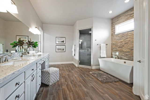 11274 S Eagle View Dr, Sandy, UT 84092 - full bathroom featuring a shower stall, a sink, double vanity, wood finished floors, and a freestanding bath