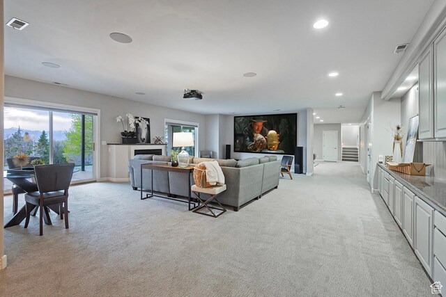 11274 S Eagle View Dr, Sandy, UT 84092 - living area featuring visible vents, baseboards, recessed lighting, light carpet, and a fireplace